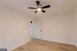 unfurnished bedroom featuring ceiling fan and light hardwood / wood-style flooring