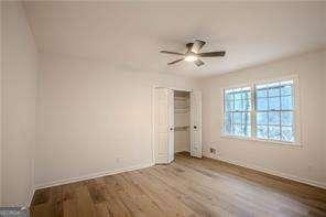 empty room with light hardwood / wood-style flooring