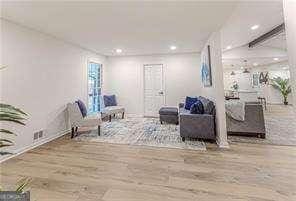 interior space featuring hardwood / wood-style flooring and beamed ceiling