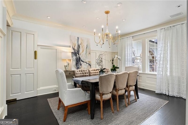 dining space with an inviting chandelier and dark hardwood / wood-style floors