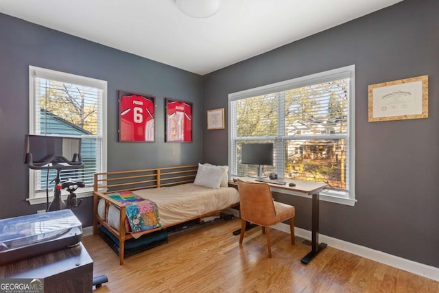 bedroom with hardwood / wood-style floors