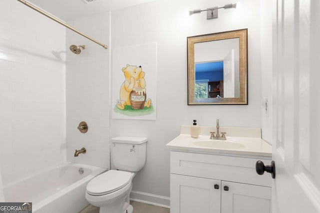 full bathroom featuring vanity, tiled shower / bath combo, and toilet