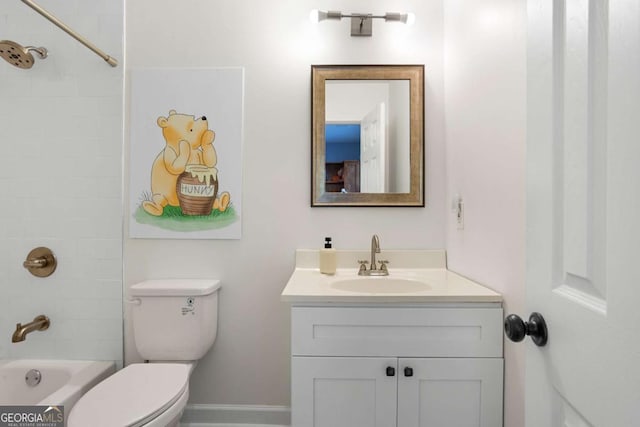 full bathroom with vanity, tiled shower / bath combo, and toilet