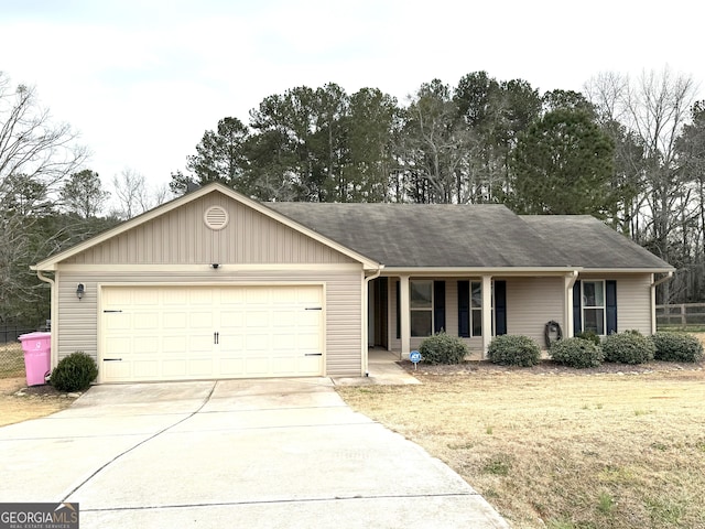 single story home with a garage and a front yard