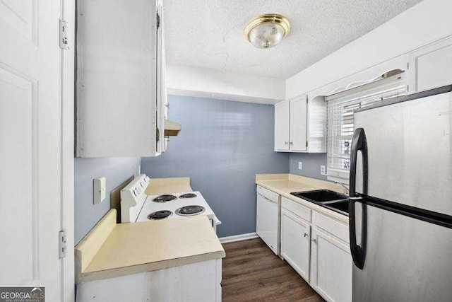 kitchen with white cabinetry, sink, white appliances, dark wood-type flooring, and a textured ceiling