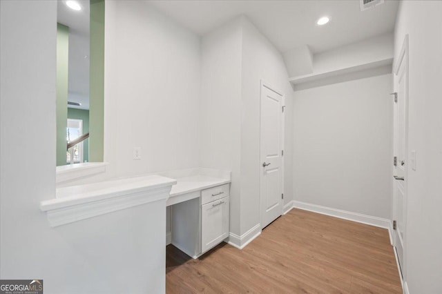 corridor featuring light hardwood / wood-style floors