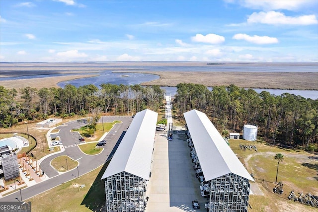 birds eye view of property featuring a water view