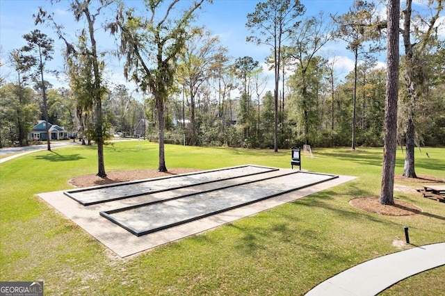 view of home's community featuring a yard