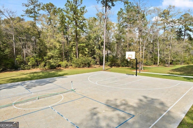 view of basketball court featuring a yard