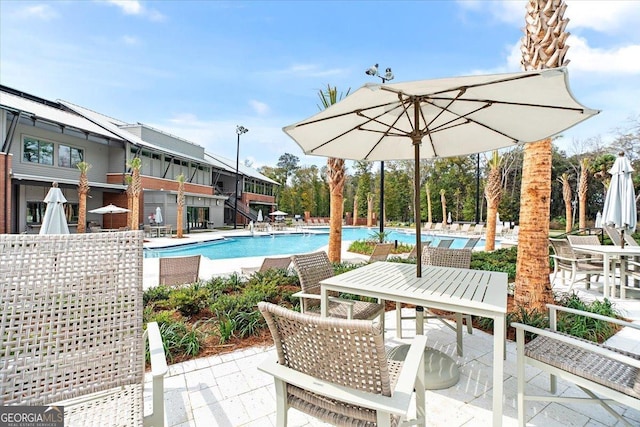 view of swimming pool with a patio