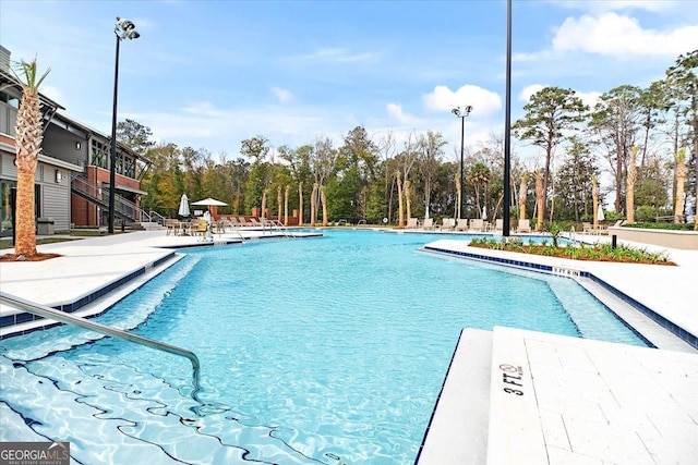 view of swimming pool featuring a patio