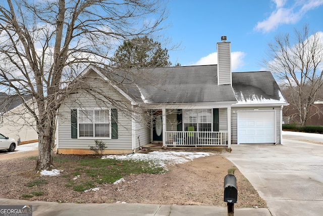 view of front facade featuring a garage and a porch