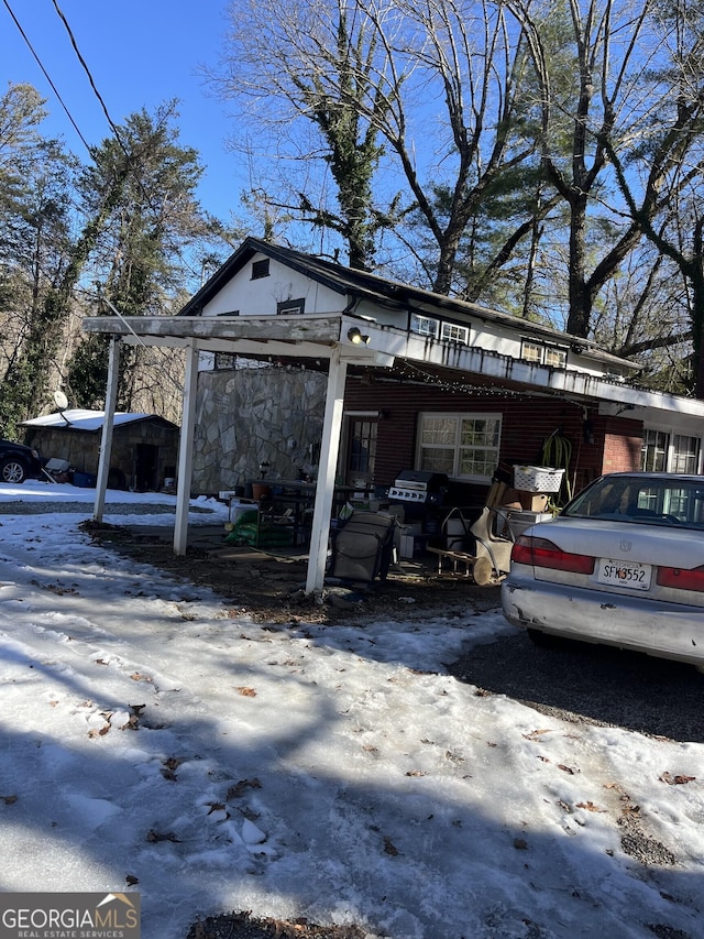 exterior space featuring a carport