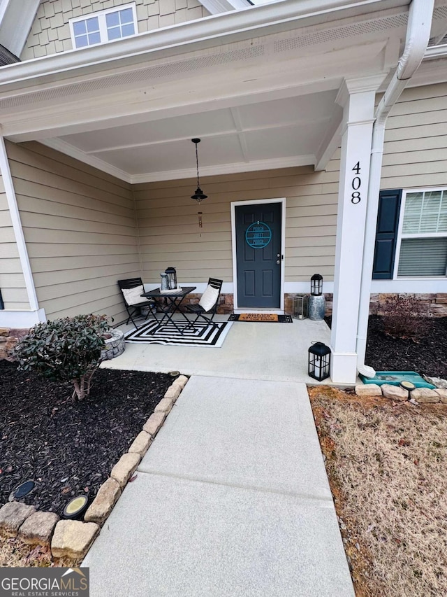 entrance to property with a patio