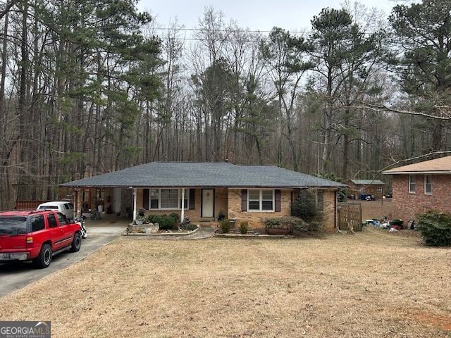 single story home with a carport and a front yard