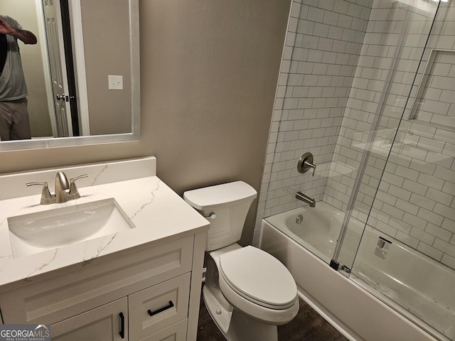 full bathroom with vanity, toilet, combined bath / shower with glass door, and wood-type flooring