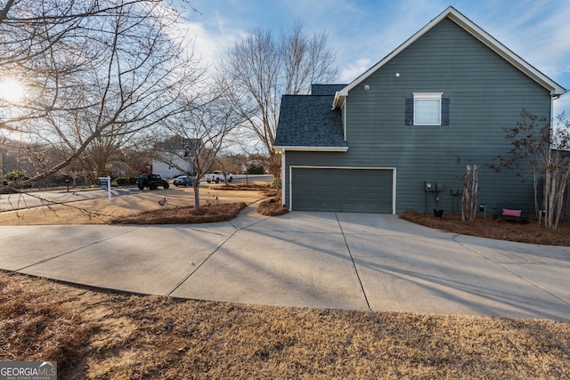 view of side of property featuring a garage