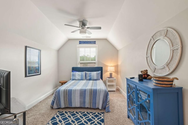 carpeted bedroom with lofted ceiling and ceiling fan