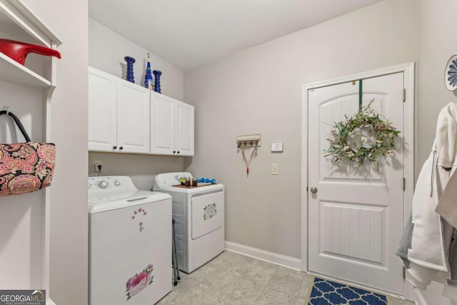 laundry area featuring cabinets and washing machine and clothes dryer