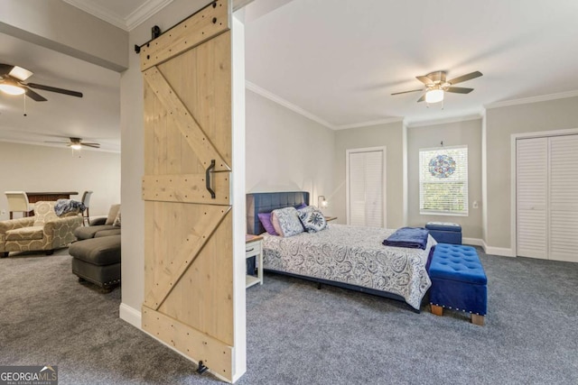 bedroom with dark carpet, a barn door, and ceiling fan