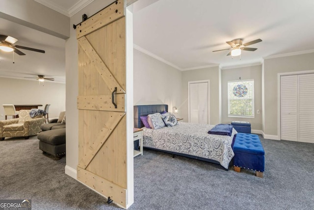 773 Riverwalk Manor Dr, Dallas, GA 30132 - carpeted bedroom with a barn door, ornamental molding, multiple closets, a ceiling fan, and baseboards