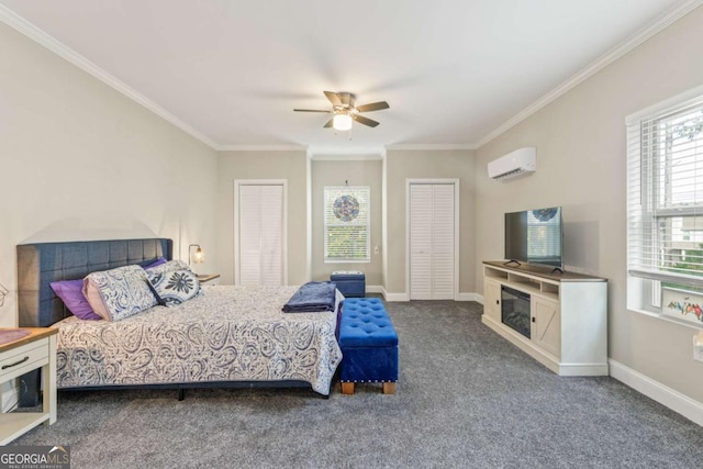 bedroom featuring crown molding, a wall mounted air conditioner, multiple closets, ceiling fan, and carpet