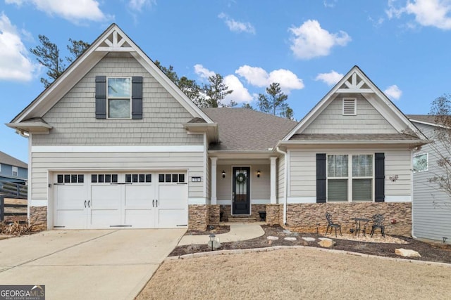 773 Riverwalk Manor Dr, Dallas, GA 30132 - craftsman inspired home featuring stone siding, driveway, and a garage