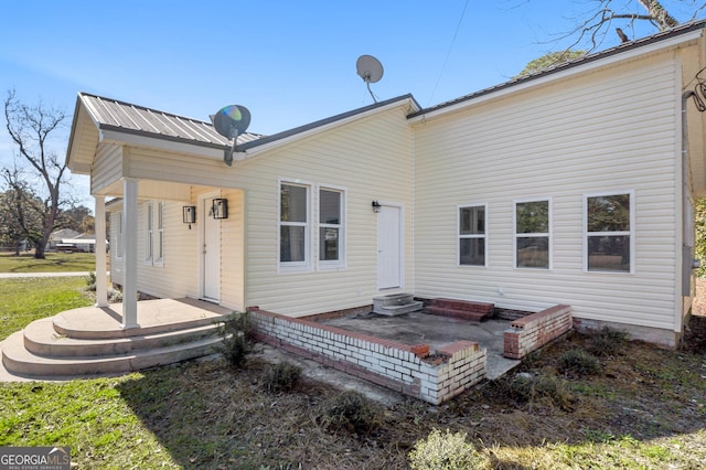 rear view of property featuring a patio