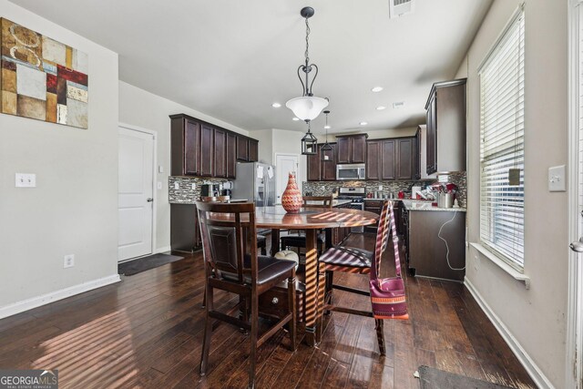 dining room featuring dark hardwood / wood-style flooring