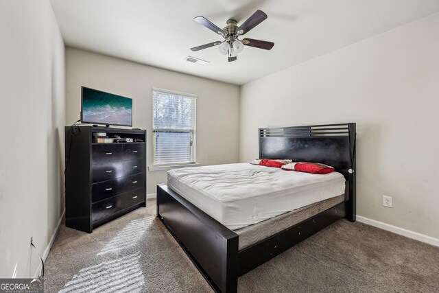 bedroom featuring light carpet, a closet, and ceiling fan