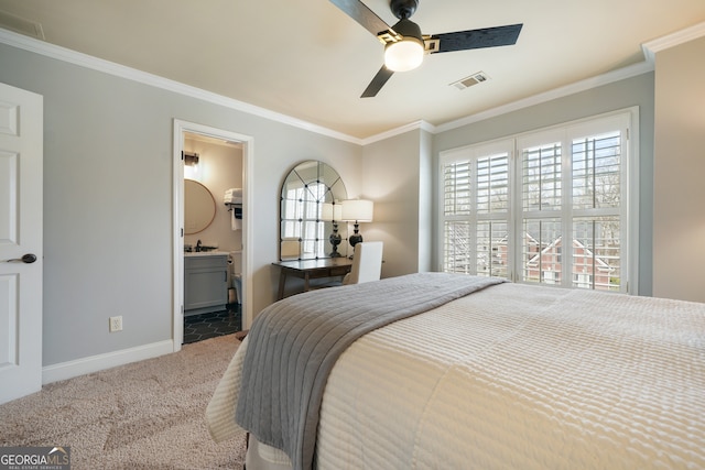 carpeted bedroom with crown molding, ceiling fan, and ensuite bathroom