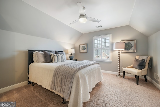 carpeted bedroom featuring vaulted ceiling and ceiling fan