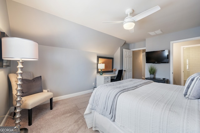 carpeted bedroom featuring ceiling fan, connected bathroom, and vaulted ceiling