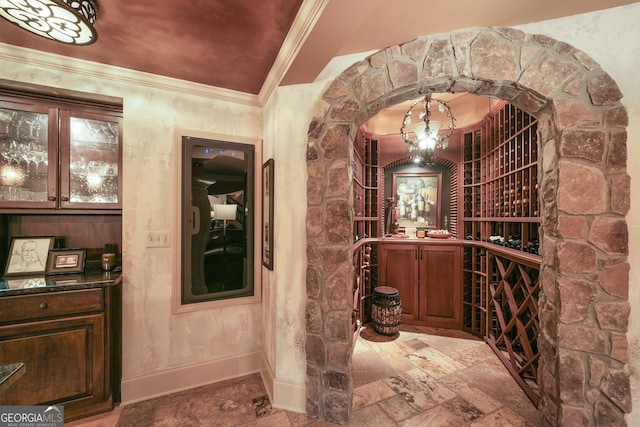 wine area with crown molding