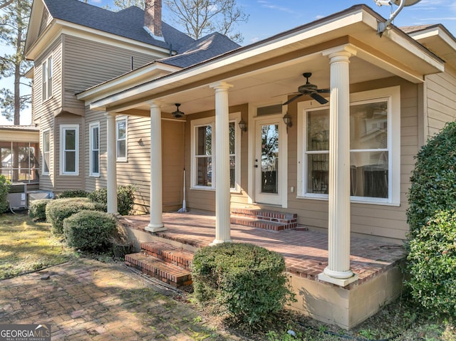 doorway to property featuring ceiling fan and covered porch