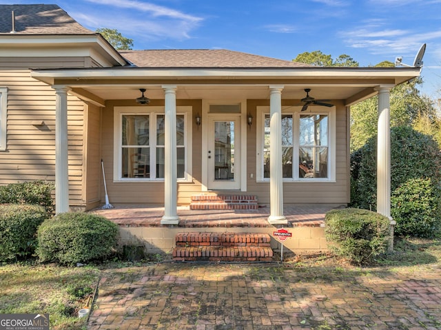 doorway to property with ceiling fan and covered porch