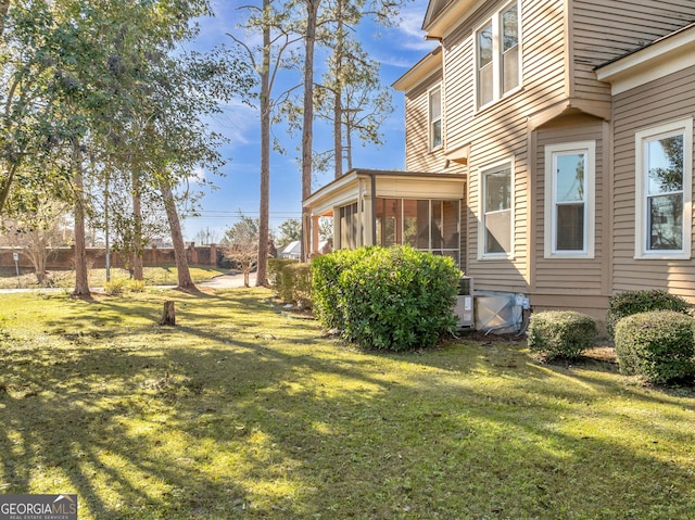 view of yard with a sunroom