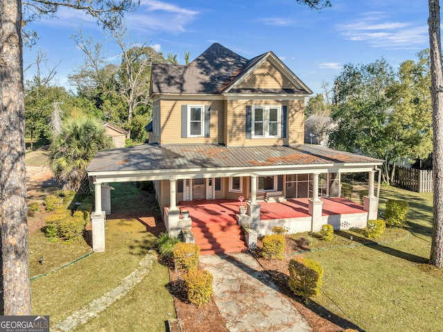 view of front of property with a porch and a front lawn