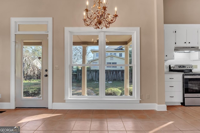 doorway to outside featuring light tile patterned floors