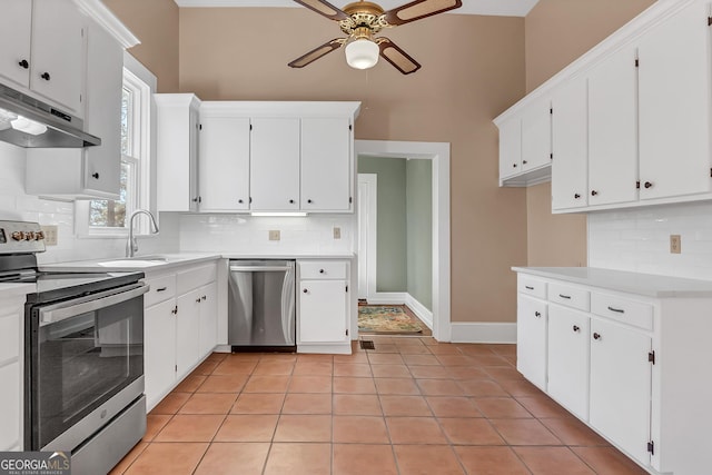 kitchen with white cabinetry, light tile patterned flooring, and appliances with stainless steel finishes