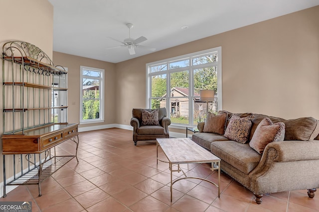 tiled living room featuring ceiling fan