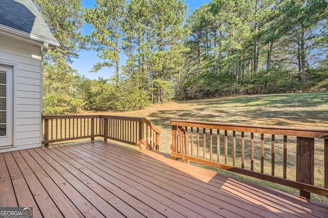 wooden terrace with a yard