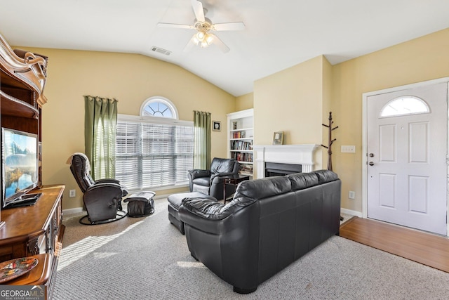 living room with vaulted ceiling and ceiling fan