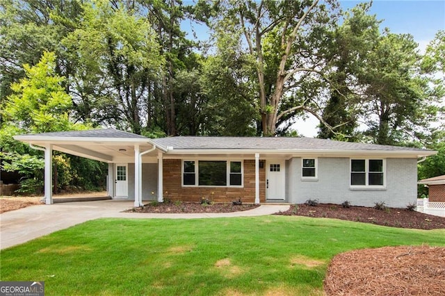 ranch-style home featuring a carport and a front yard