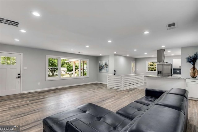 living room with light hardwood / wood-style flooring