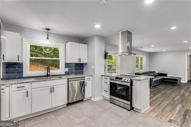 kitchen with white cabinetry, island exhaust hood, dishwashing machine, and stainless steel electric range