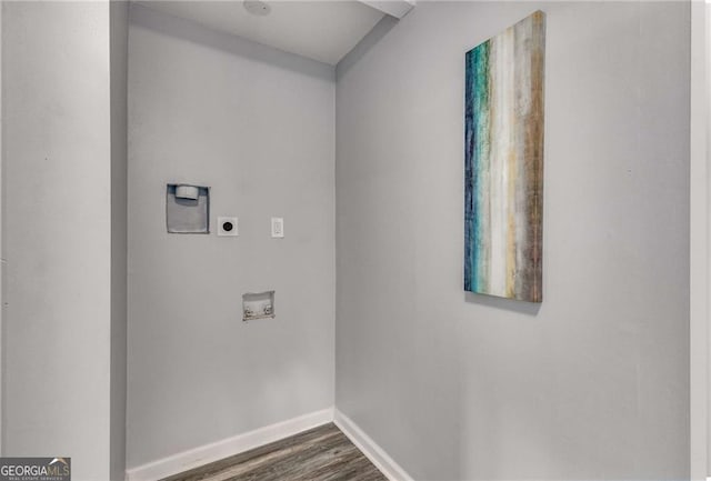 laundry room featuring dark hardwood / wood-style floors, hookup for an electric dryer, and hookup for a washing machine