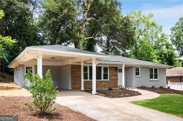 single story home featuring a carport