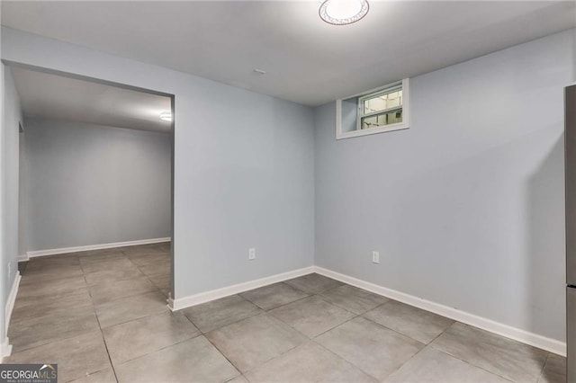 basement with light tile patterned flooring