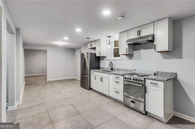 kitchen with white cabinetry, light stone counters, pendant lighting, and stainless steel appliances